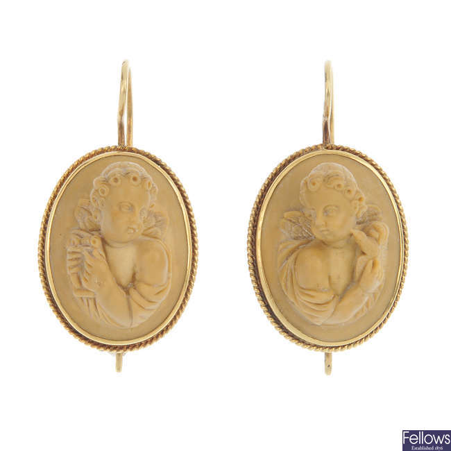 A pair of late 19th century gold lava cameo earrings.