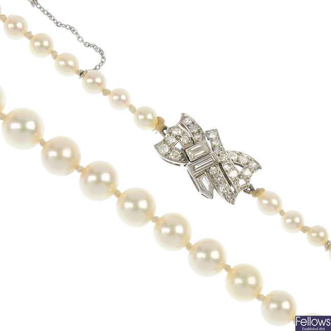 A cultured pearl necklace with an early 20th century diamond clasp.