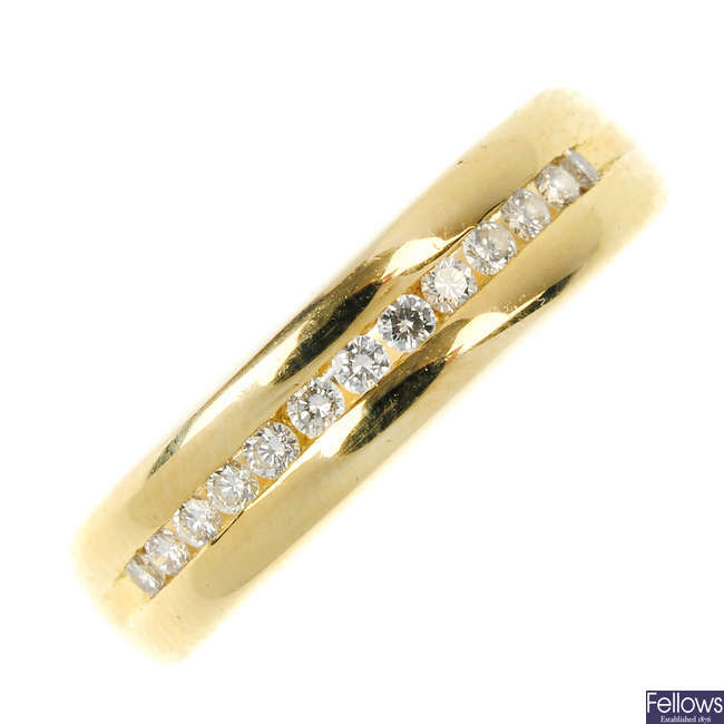 An 18ct gold diamond half-circle eternity ring.