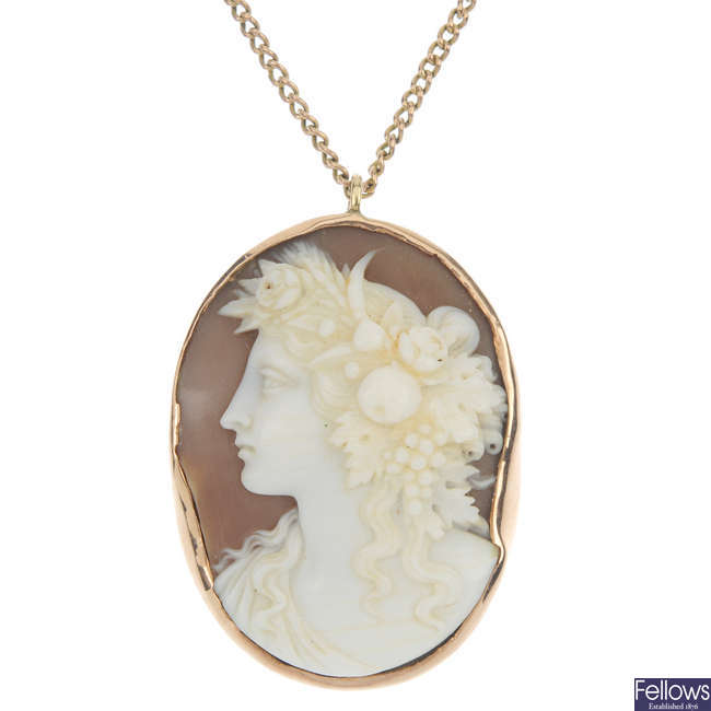 An early 20th century gold cameo pendant with chain.