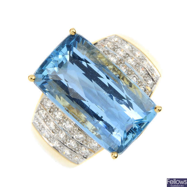 An 18ct gold aquamarine and diamond ring.