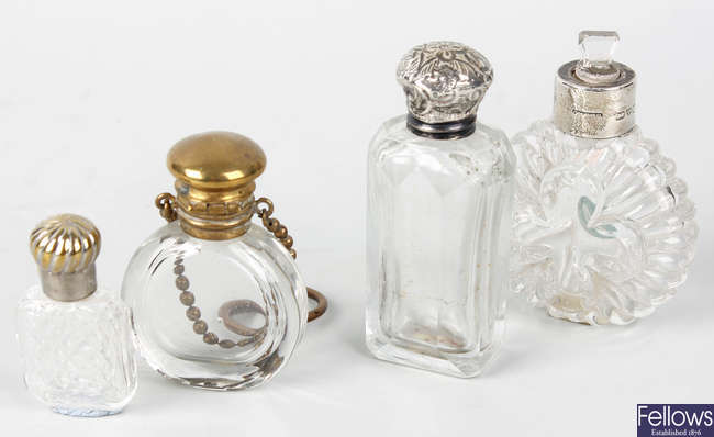 Five clear glass scent bottles
