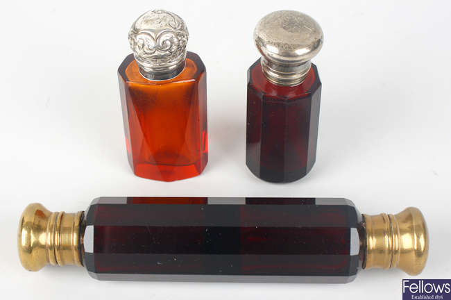 Three red glass scent bottles