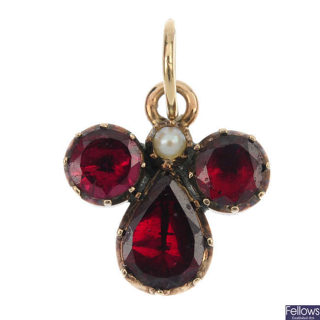 A late 19th century gold foil-back garnet and seed pearl pendant.