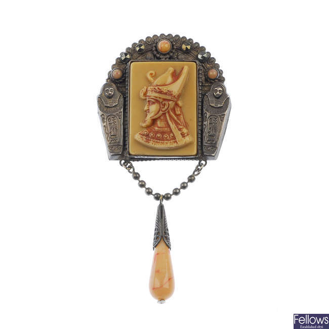 An early 20th century Egyptian revival plastic and paste brooch.