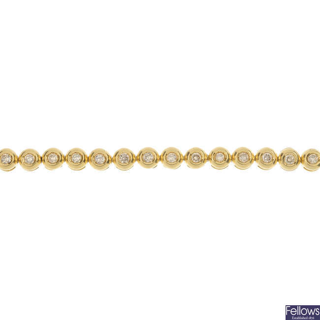 An 18ct gold diamond line bracelet.