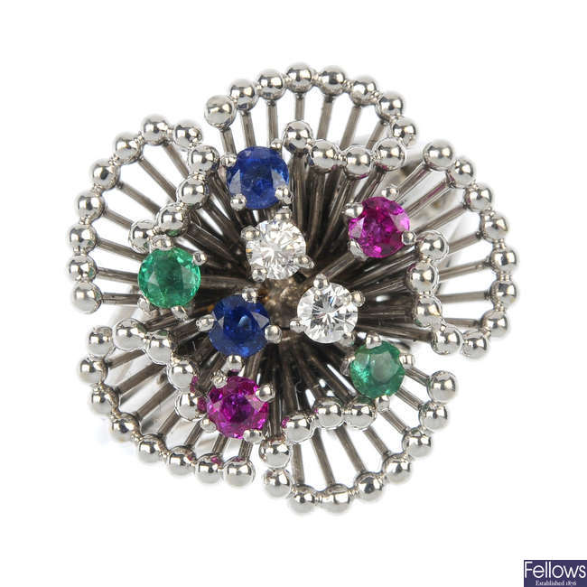 A multi-gem dress ring. 