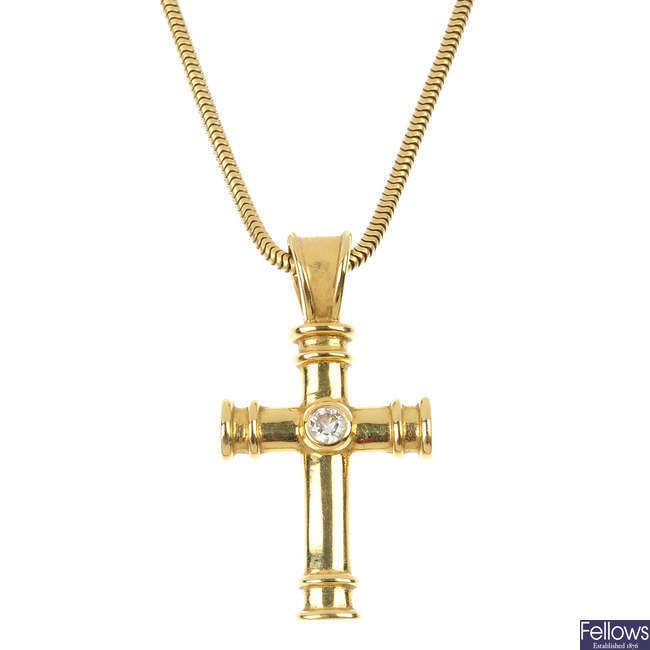 THEO FENNELL - an 18ct gold diamond cross pendant.