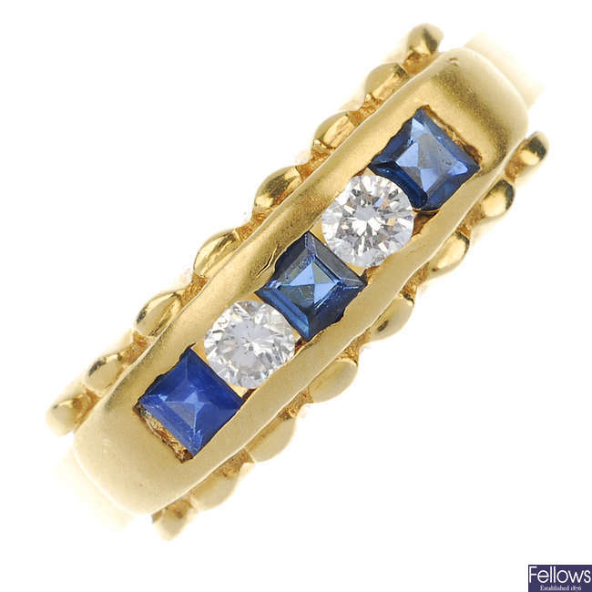 A sapphire and diamond five-stone panel ring.