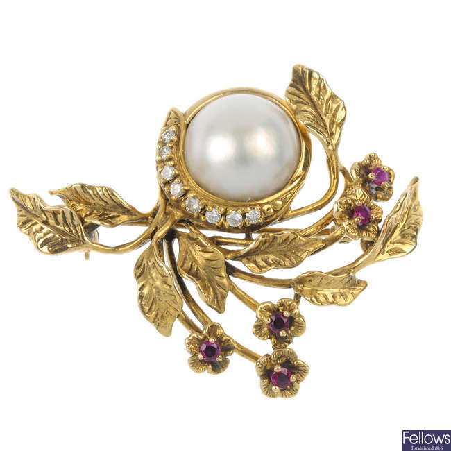 GIVENCHY - a 1980s 14ct gold diamond and gem-set floral brooch.