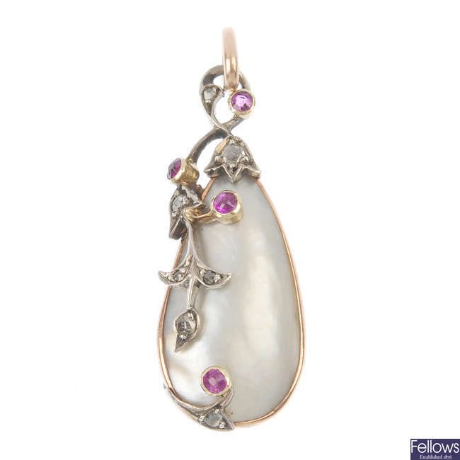 An Edwardian silver and gold blister pearl, ruby and diamond pendant.
