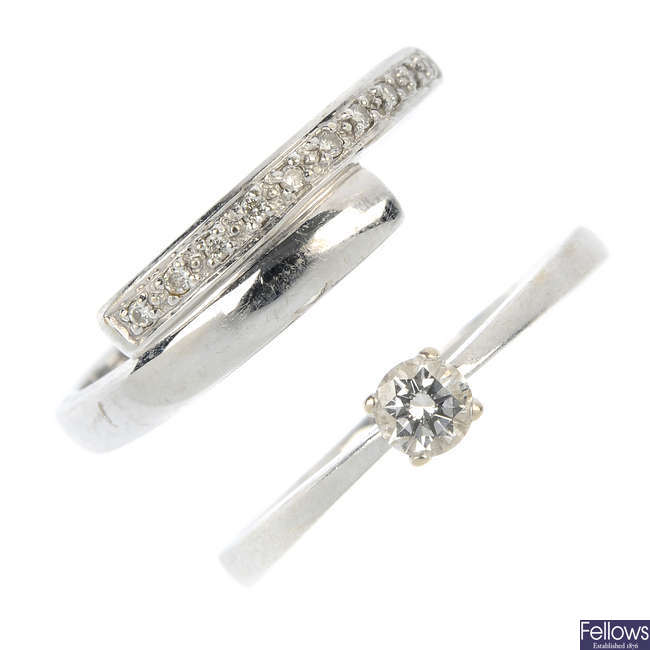 A diamond single-stone ring and a diamond crossover ring.