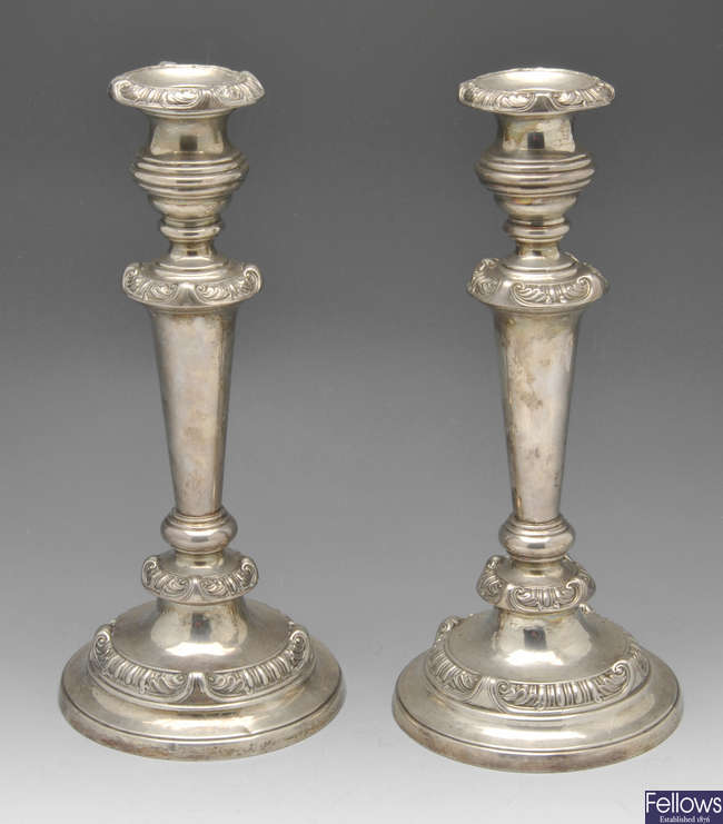 A pair of George III silver mounted candlesticks.
