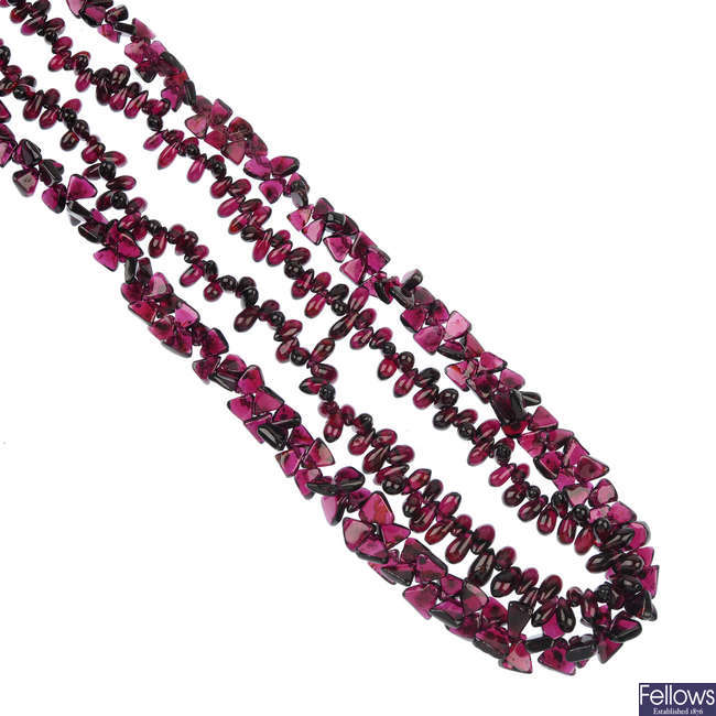 Two garnet bead single-strand necklaces.