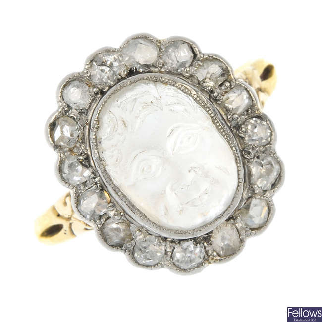 A late 19th century silver and gold moonstone and diamond cluster ring.