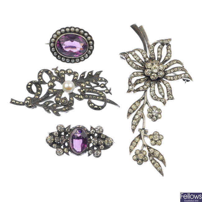 Four items of early 20th century silver paste and marcasite jewellery.