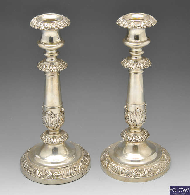 A pair of William IV silver candlesticks.