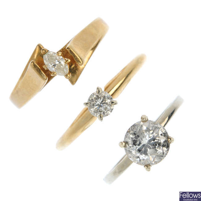 A selection of three 9ct gold diamond single-stone rings.