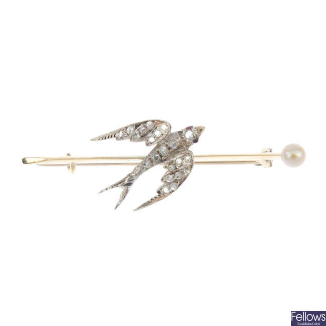 An early 20th century silver and 9ct gold diamond bird brooch.