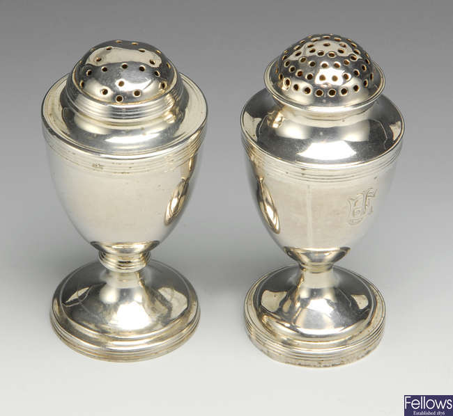 Two Georgian silver pepper pots.