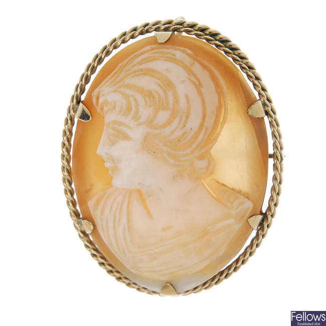 A shell cameo brooch, a paste ring and a paste pendant.