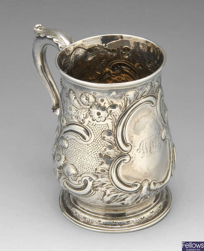 An 18th century silver mug.