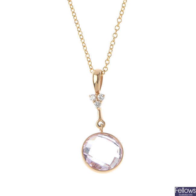A rose quartz and diamond pendant.