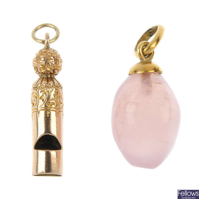 A whistle pendant and a rose quartz pendant.