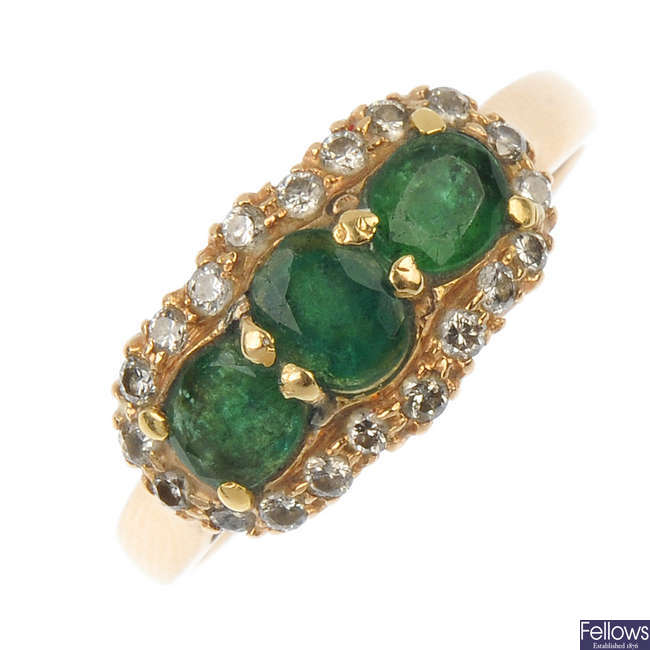 An emerald and diamond dress ring. 