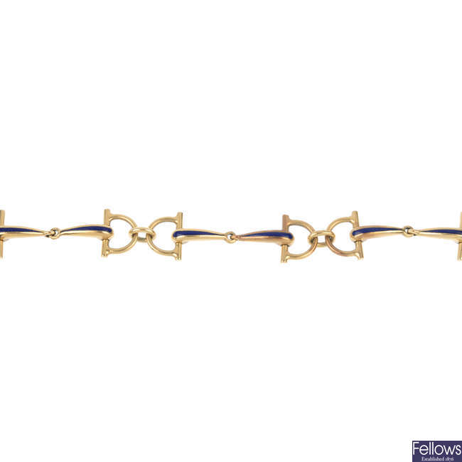 GUCCI - a 1970s 9ct gold enamel 'horsebit' bracelet.
