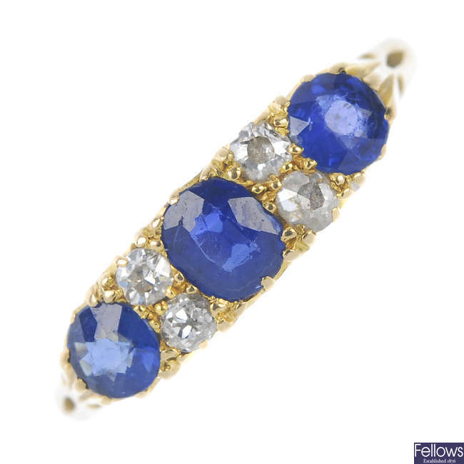 An early 20th century 18ct gold diamond and sapphire seven-stone dress ring.