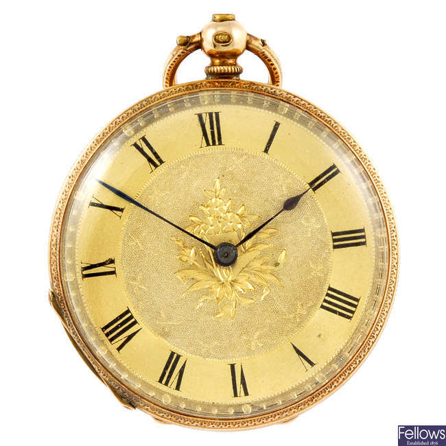 A yellow metal open face fob watch.