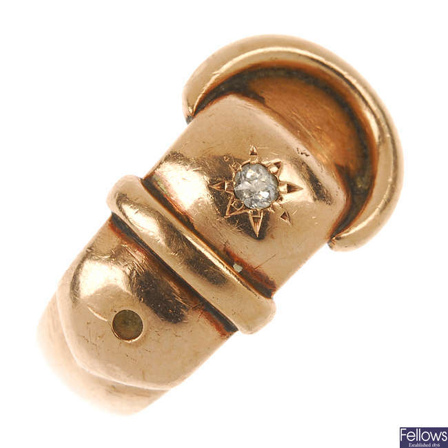 An Edwardian 9ct gold diamond accent buckle ring.