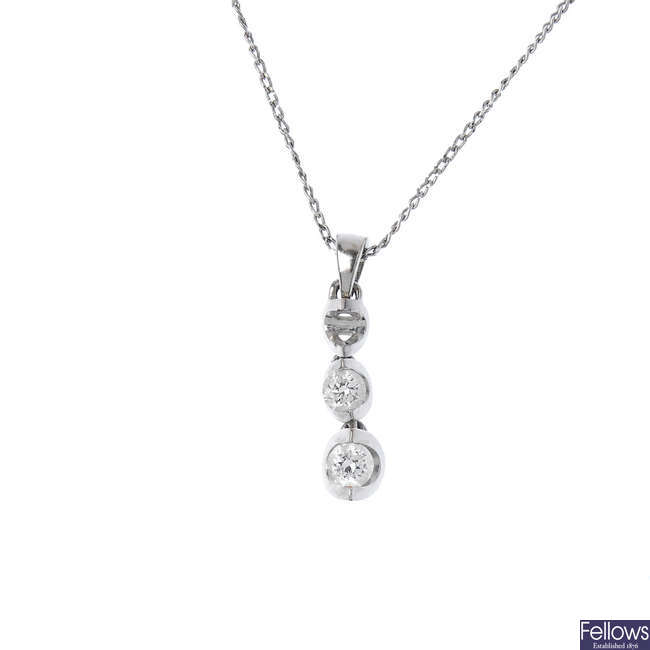 An 18ct gold diamond pendant and chain, AF and a single diamond-set earring.