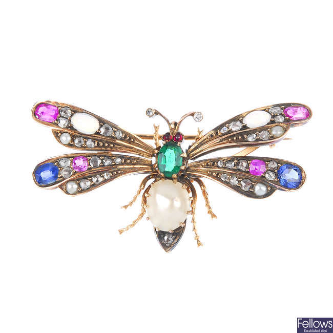 A diamond and gem-set butterfly brooch.