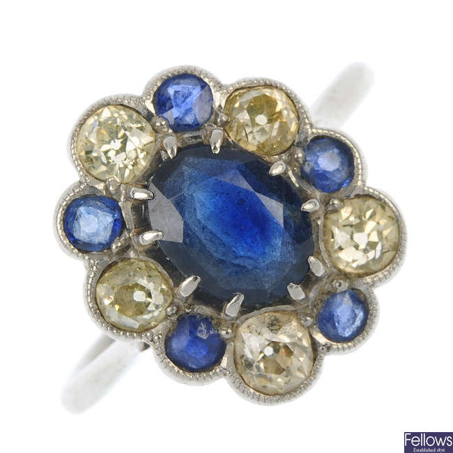 A mid 20th century platinum, diamond and sapphire cluster ring.