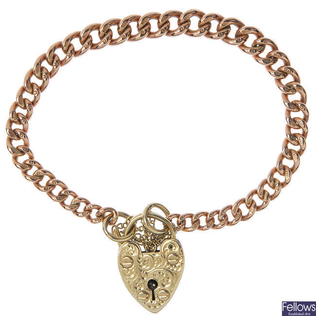 An early 20th century 9ct gold curb-link bracelet and loose padlock clasp. 