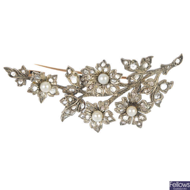 An early 20th century silver and gold diamond cultured pearl brooch.