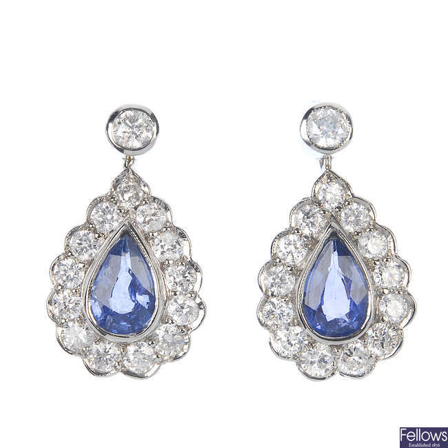 A pair of sapphire and diamond cluster ear pendants.