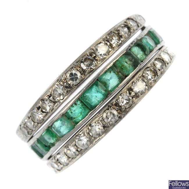 An emerald, ruby and diamond swivel ring.