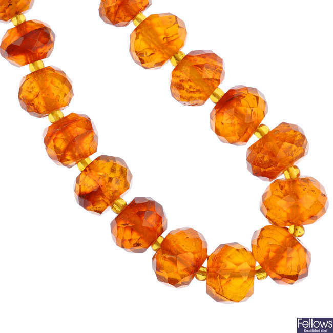 A natural Baltic amber faceted bead necklace and a modified Baltic amber bead necklace.