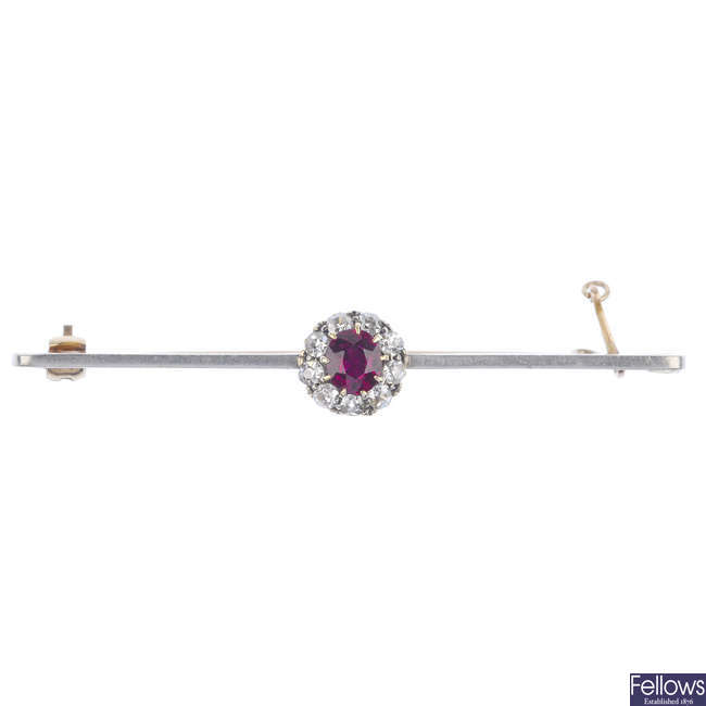 An early 20th century ruby and diamond cluster bar brooch.