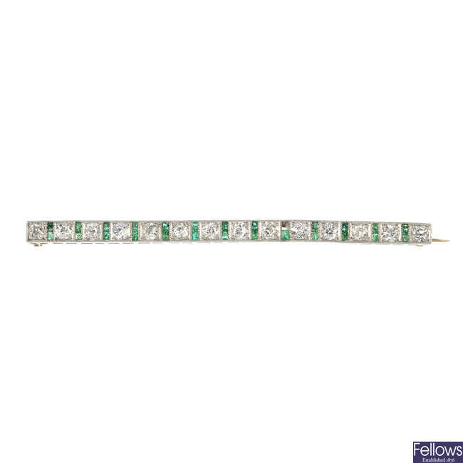 A mid 20th century diamond and emerald brooch.