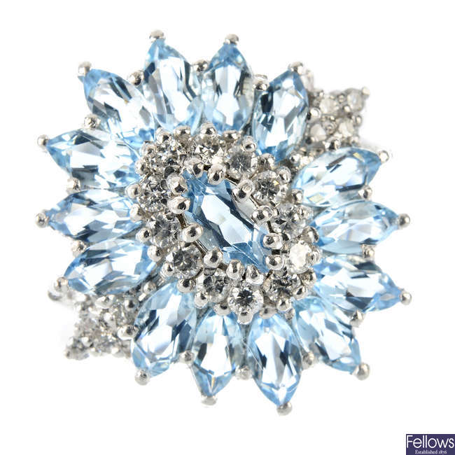 An 18ct gold aquamarine and diamond dress ring. 