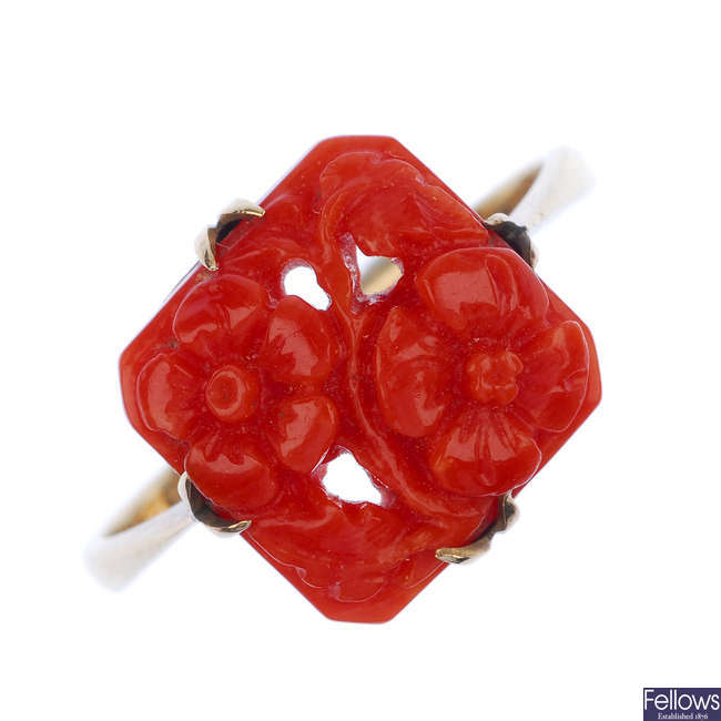 A mid 20th century coral ring and ear clip set.