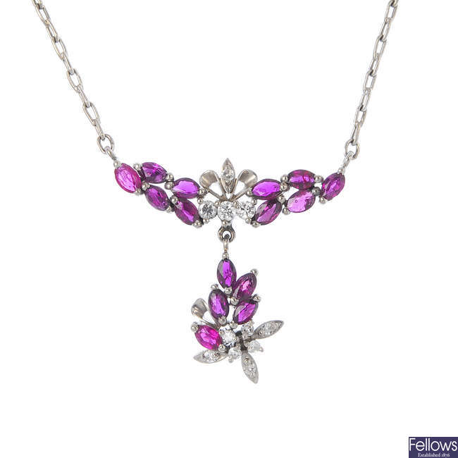 A ruby and diamond foliate necklace.