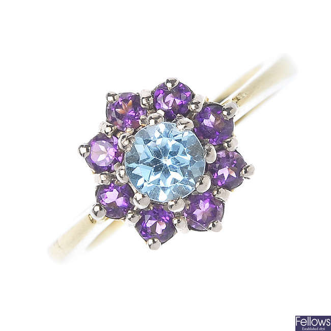 An 18ct gold topaz and amethyst cluster ring. 