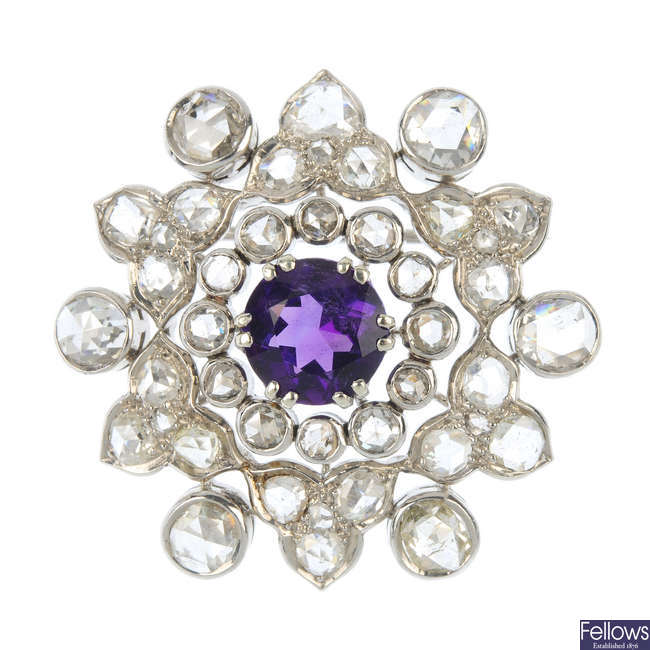 A diamond and amethyst brooch and ear clip set.