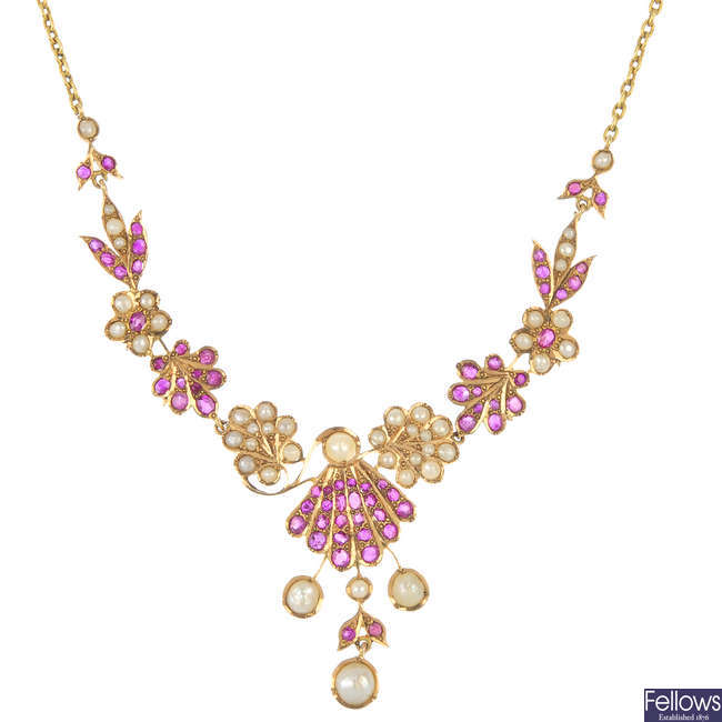A ruby and split pearl floral necklace.