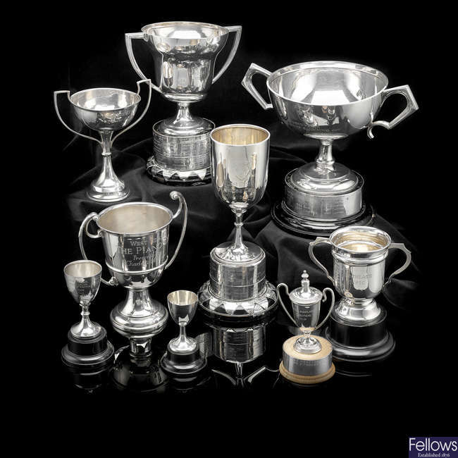A collection of nine West Heath School silver trophies.